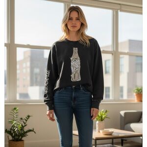 The Laundry Room Black Crewneck Sweater with Coca Cola Silver Design.